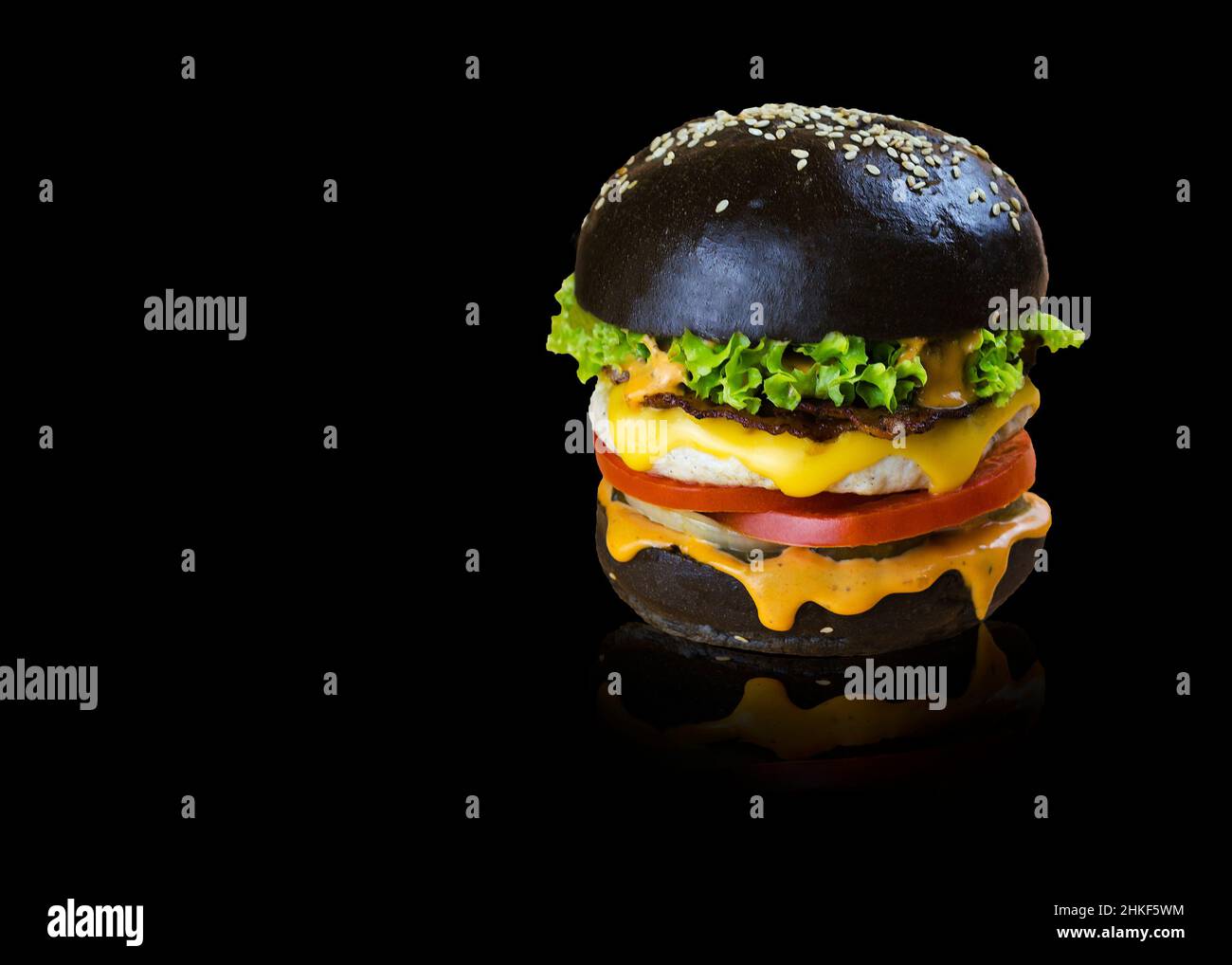 appetizing burger on a black background Stock Photo