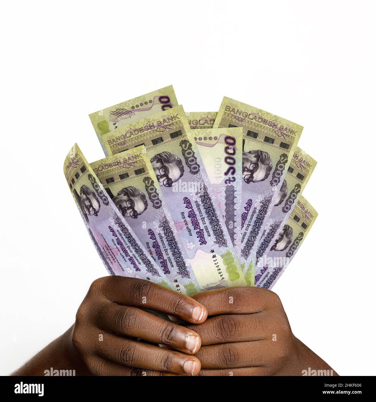 Black hands holding 3D rendered Bangladesh taka notes. closeup of Hands holding Bangladesh currency bank notes Stock Photo