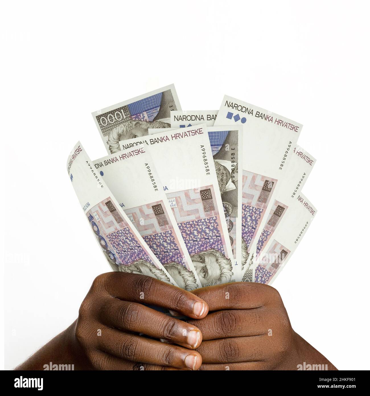 Black hands holding 3D rendered 1000 Croatian Kuna notes. closeup of