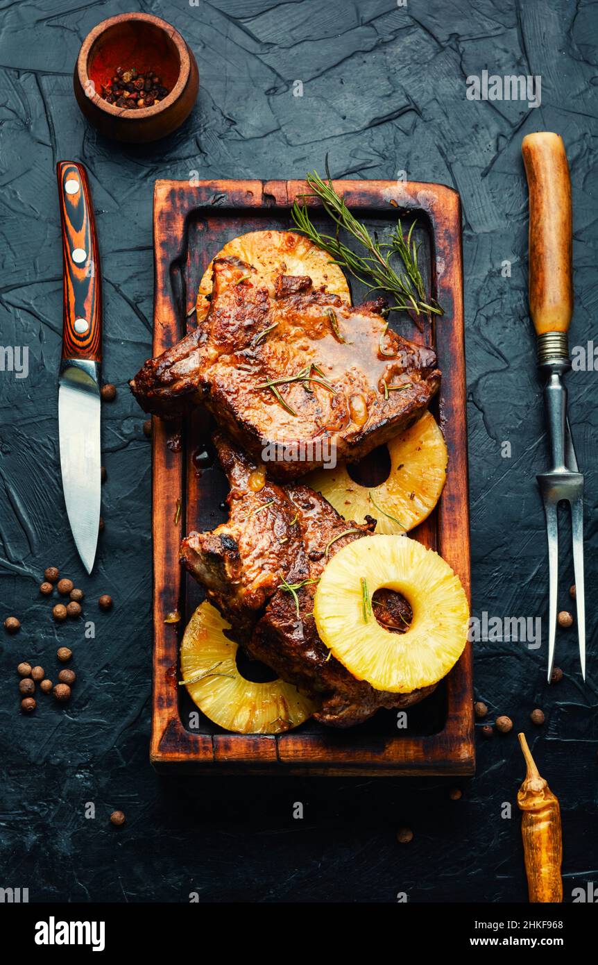 Appetizing beef meat baked with pineapple rings. Beef entricote in fruit  marinade. Space for text Stock Photo - Alamy