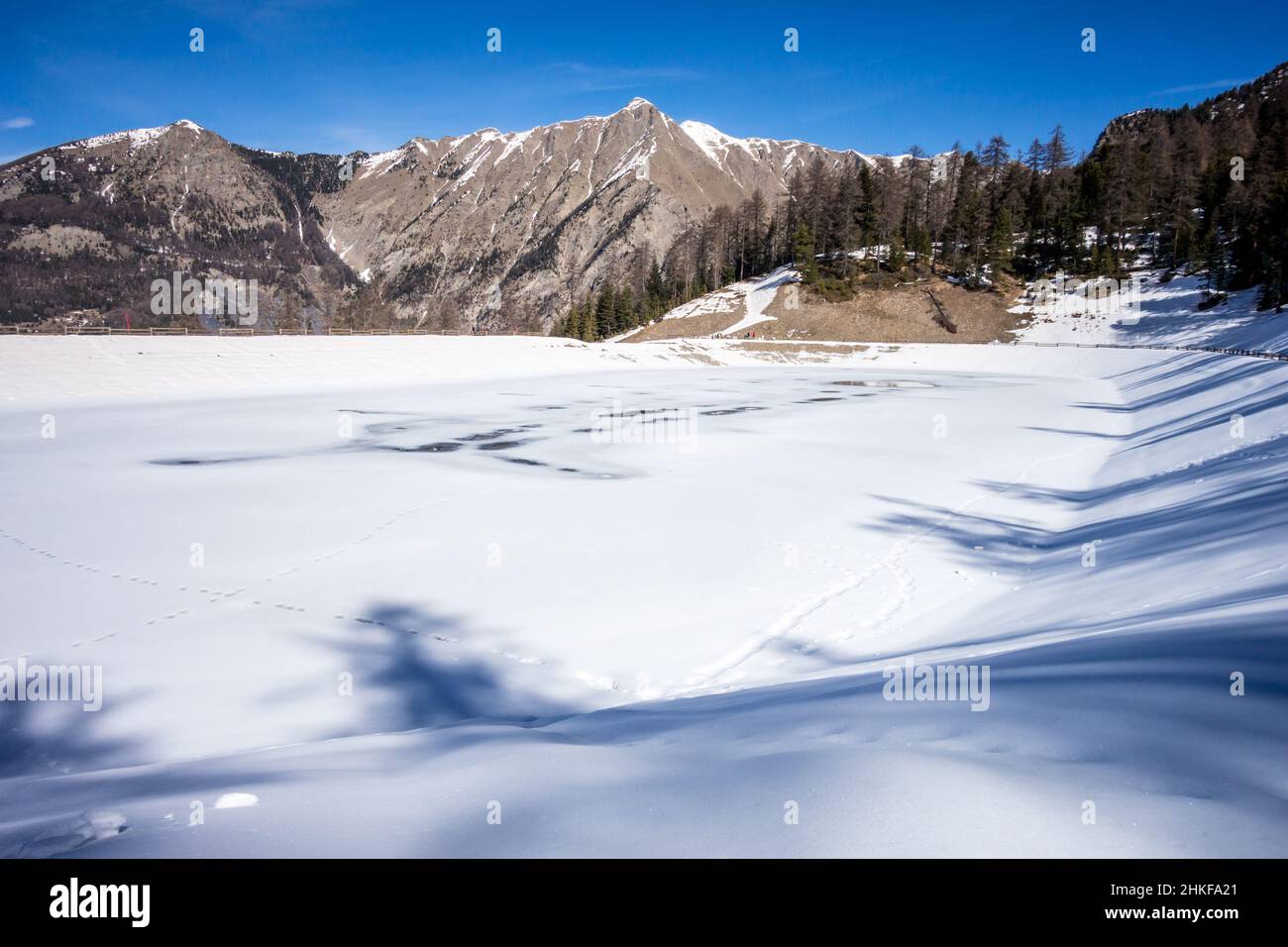 Mountain landscape under snow in winter and frozen lake Stock Photo