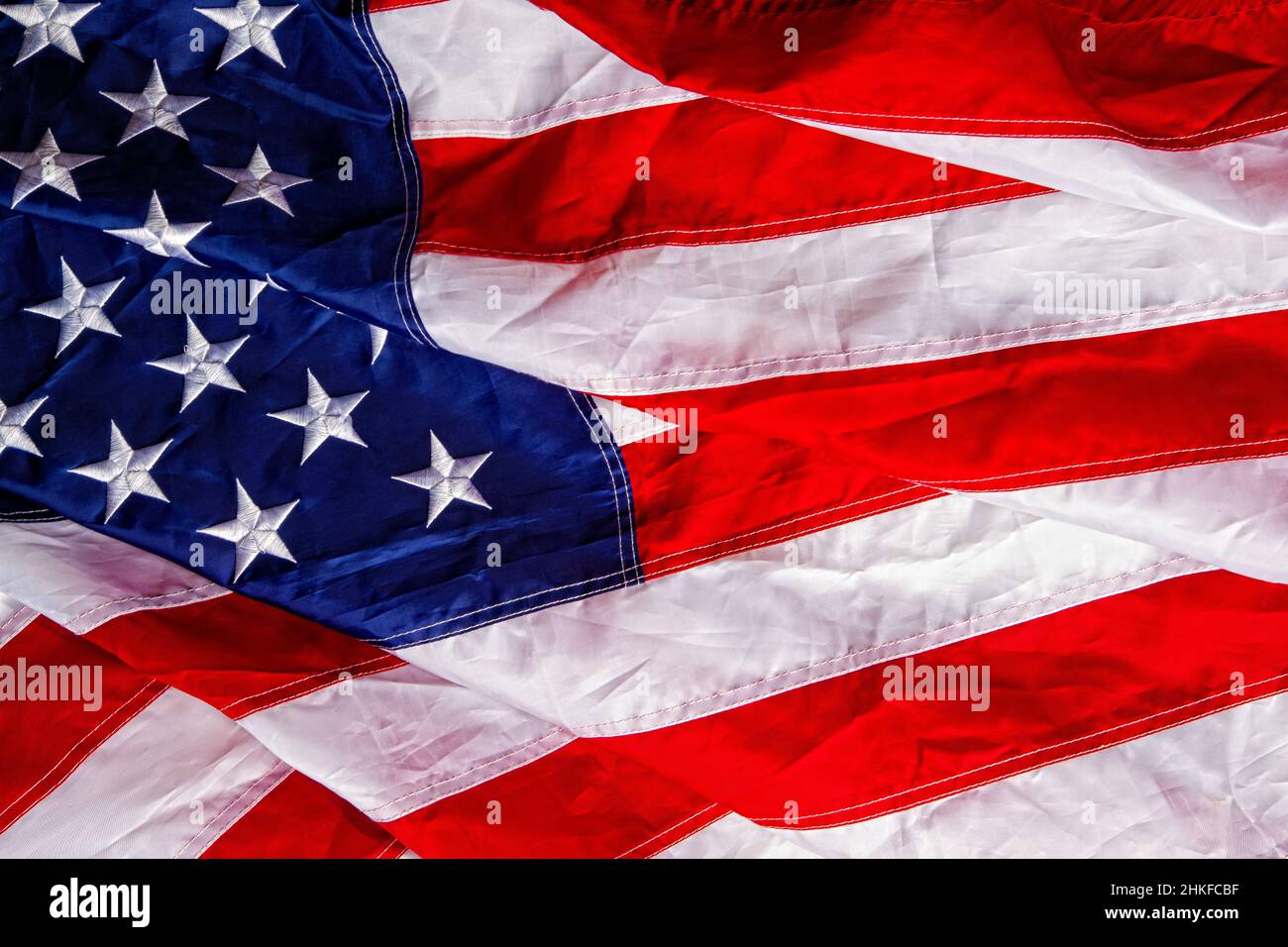 Beautiful star-striped flag waving the state symbol of the United States of America close-up Stock Photo