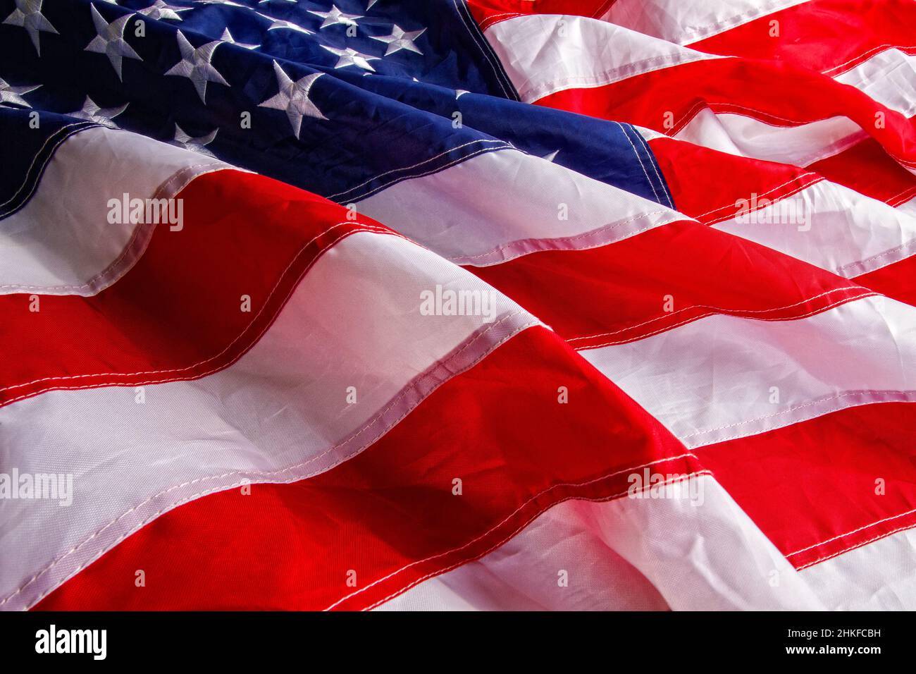 Beautiful star-striped flag waving the state symbol of the United States of America close-up Stock Photo