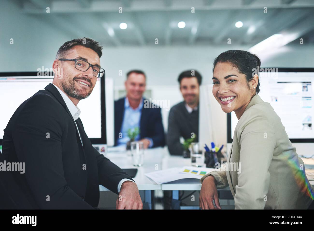 Working Cooperate Success is the product of teamwork. Shot of corporate colleagues ...