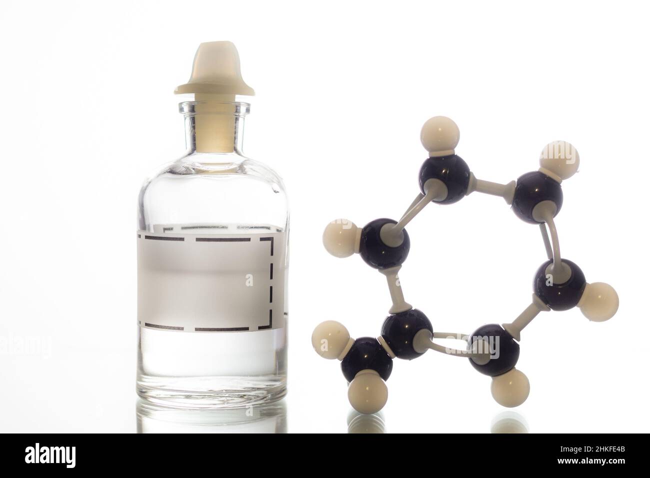 A reagent bottle containing toluene and its chemical structure. Stock Photo