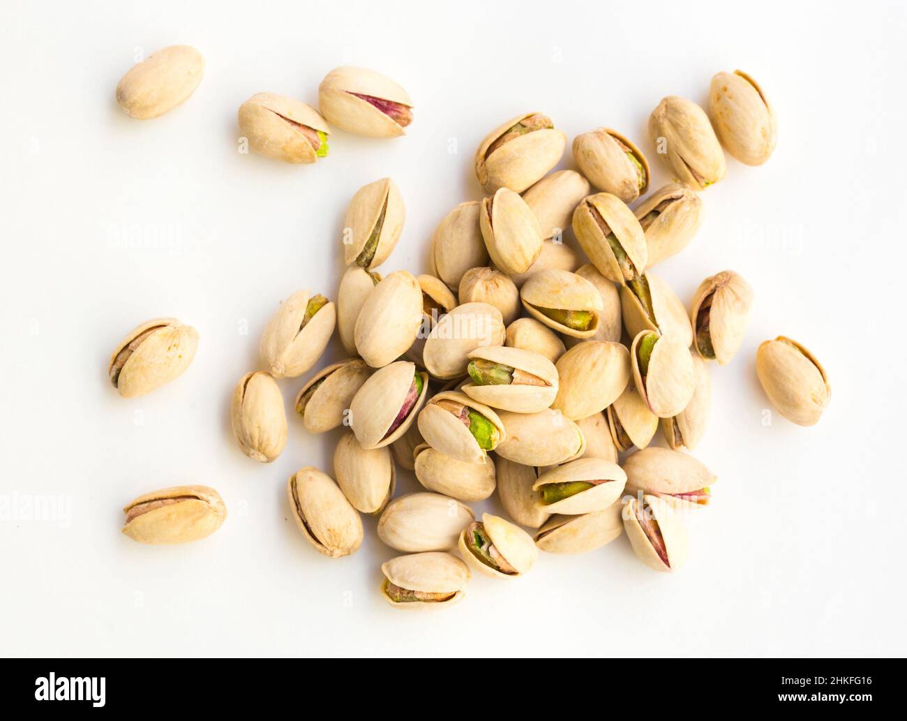 roasted pistachios on white background Stock Photo Alamy