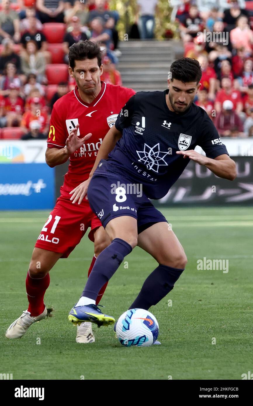 Adelaide, Australia, 4 February, 2022. Paulo Retre of Sydney FC attacks the ball against Javier López Rodriguez of Adelaide United during the A-League soccer match between Adelaide United and Sydney FC. Credit: Peter Mundy/Speed Media/Alamy Live News Stock Photo