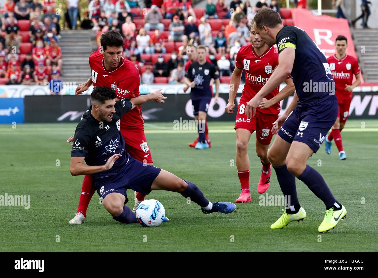 Adelaide, Australia, 4 February, 2022. Paulo Retre of Sydney FC attacks the ball against Javier López Rodriguez of Adelaide United during the A-League soccer match between Adelaide United and Sydney FC. Credit: Peter Mundy/Speed Media/Alamy Live News Stock Photo