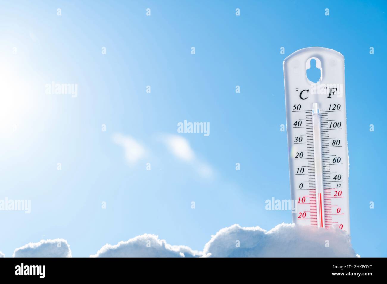 Thermometer in the snow. Climate, weather, forecast. Temperatures outside. Thermometer in the snow shows temperatures below zero. Low temperatures in Stock Photo