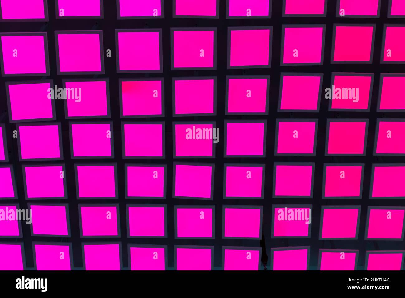 Pink neon vibrant square tiles modern background. Stock Photo