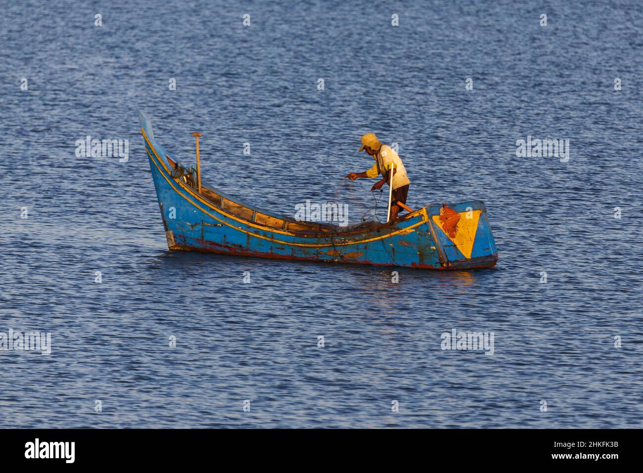 Fishing boat and fisherman in the sea at dawn in Banda Aceh, Indonesia Stock Photo
