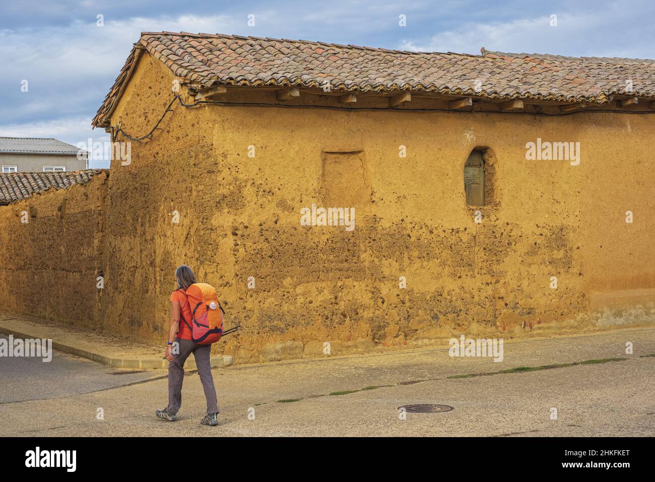 Spain, Castile and León, El Burgo Ranero, hike on the Camino Francés, Spanish route of the pilgrimage to Santiago de Compostela, listed as a UNESCO World Heritage Site, adobe house Stock Photo