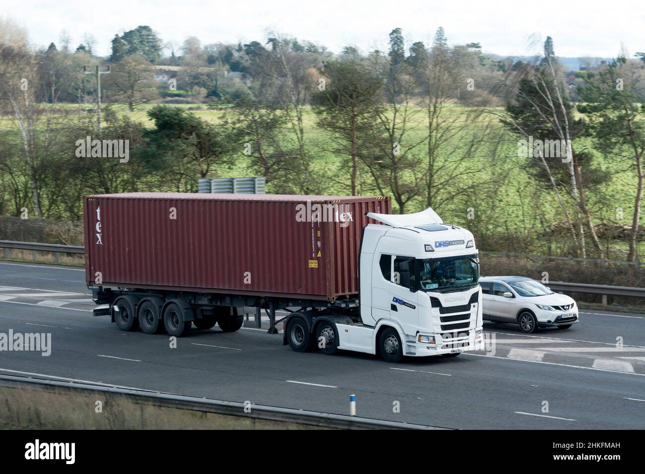 DRS Logistics lorry carrying a Tex shipping container, M40 motorway, Warwickshire, UK Stock Photo