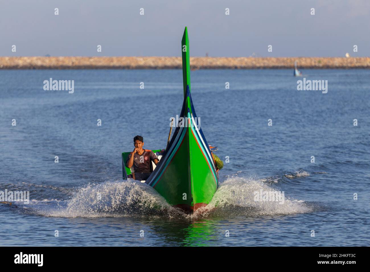 Aceh, Indonesia. 12 Jan 2022. Fishing boat and fisherman in the sea at dawn, Banda Aceh, Indonesia Stock Photo