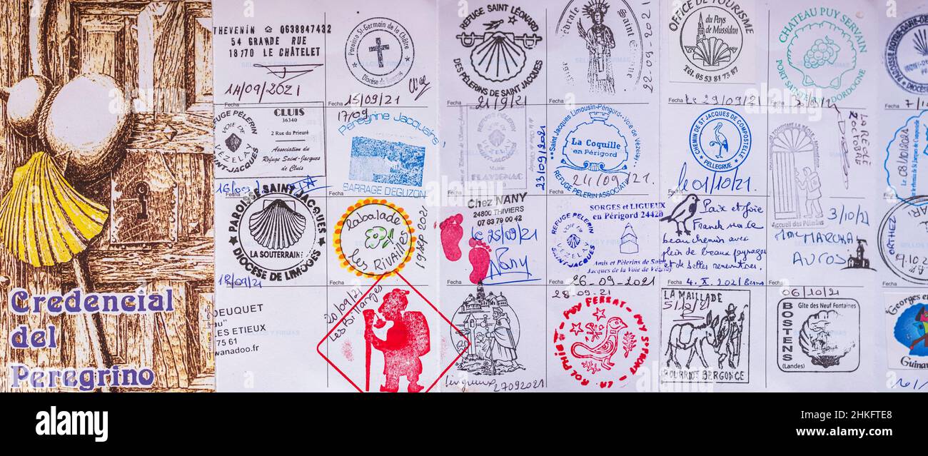 France, Pyrenees-Atlantiques, Saint-Jean-Pied-de-Port, the credential (issued by associations or by the Church), veritable pilgrim's passport, opens to a duty of respect and tolerance and allows contemporary pilgrims to access the lodgings and to obtain the Compostela (pilgrimage certificate) upon arrival in Santiago de Compostela Stock Photo
