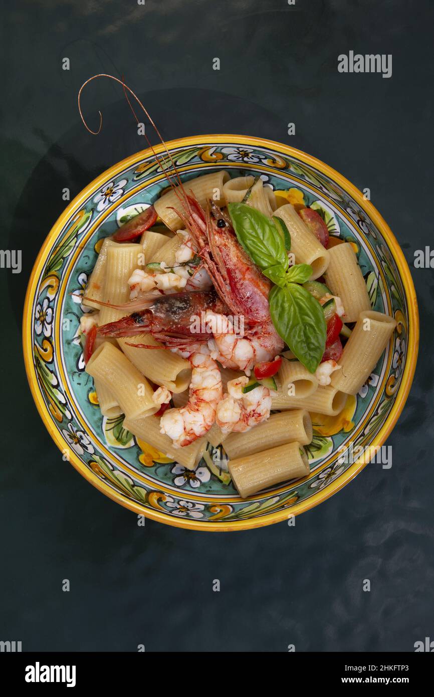 Italy, Sicily, Taormina, San Domenico palace hotel, dish of rigatoni with prawns in a hand-painted plate prepared by Massimo Mantarro chef at the San Domenico palace hotel, a former Dominican convent transformed into a legendary hotel owned by the Four Seasons Stock Photo