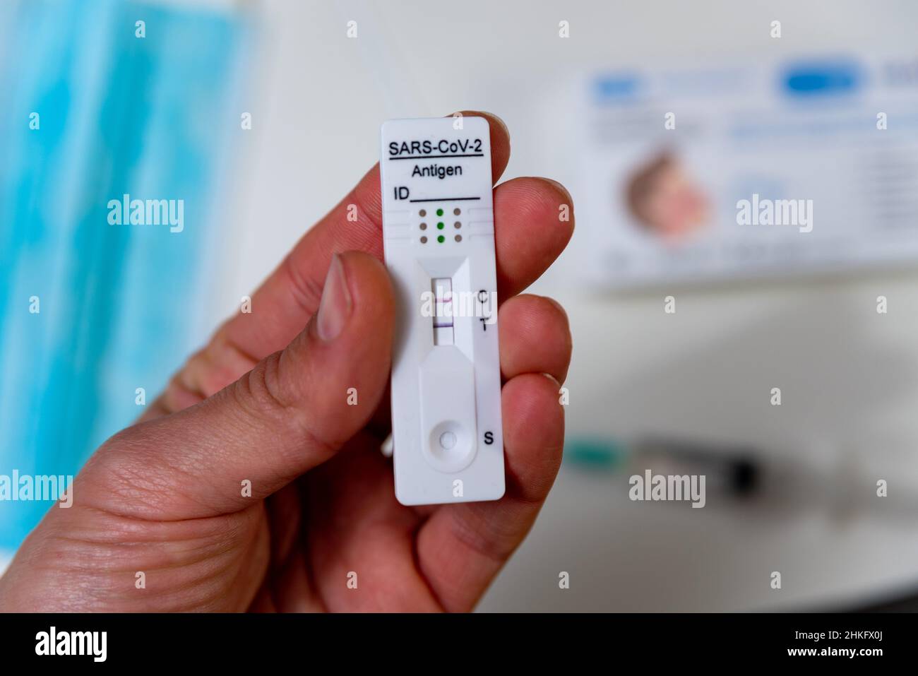 Person holding positive lateral flow test hires stock photography and