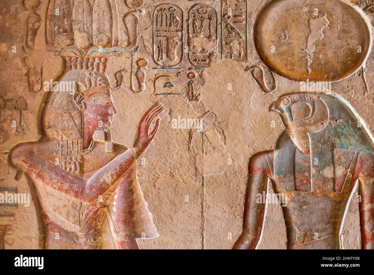 Egypt, Upper Egypt, Nile Valley, Luxor, Valley of the Kings, Listed as World Heritage Site by UNESCO, colourful bas relief depicting Pharaoh on a wall of the tomb of Ramses III Stock Photo