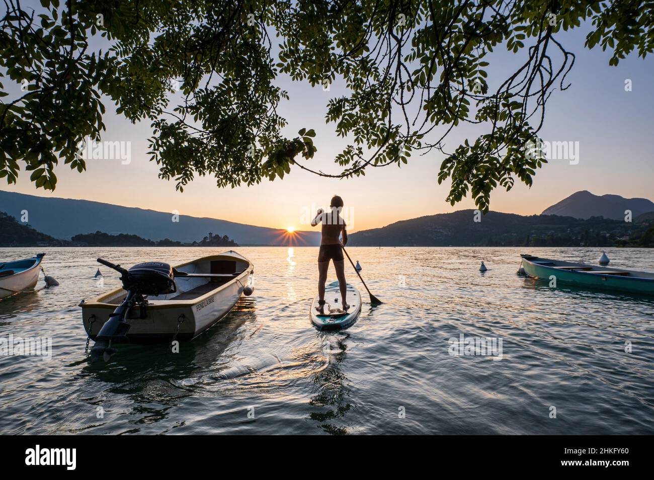 France, Haute-Savoie (74), Annecy, Lake Annecy, stand up paddle at sunset Stock Photo