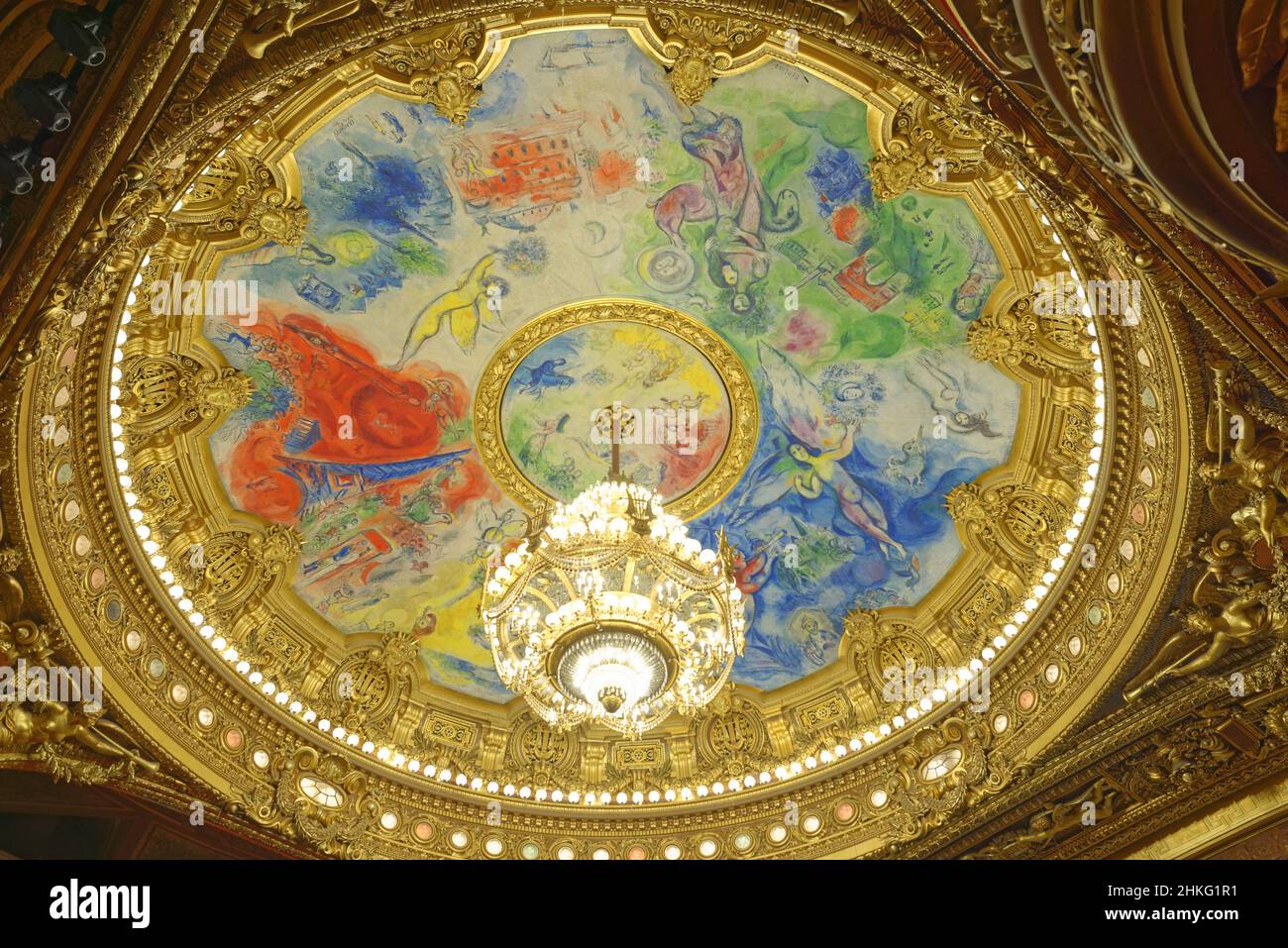 France, Paris, the Garnier Opera, ceiling decorated by Marc Chagall in the auditorium, at the center the grand chandelier Stock Photo