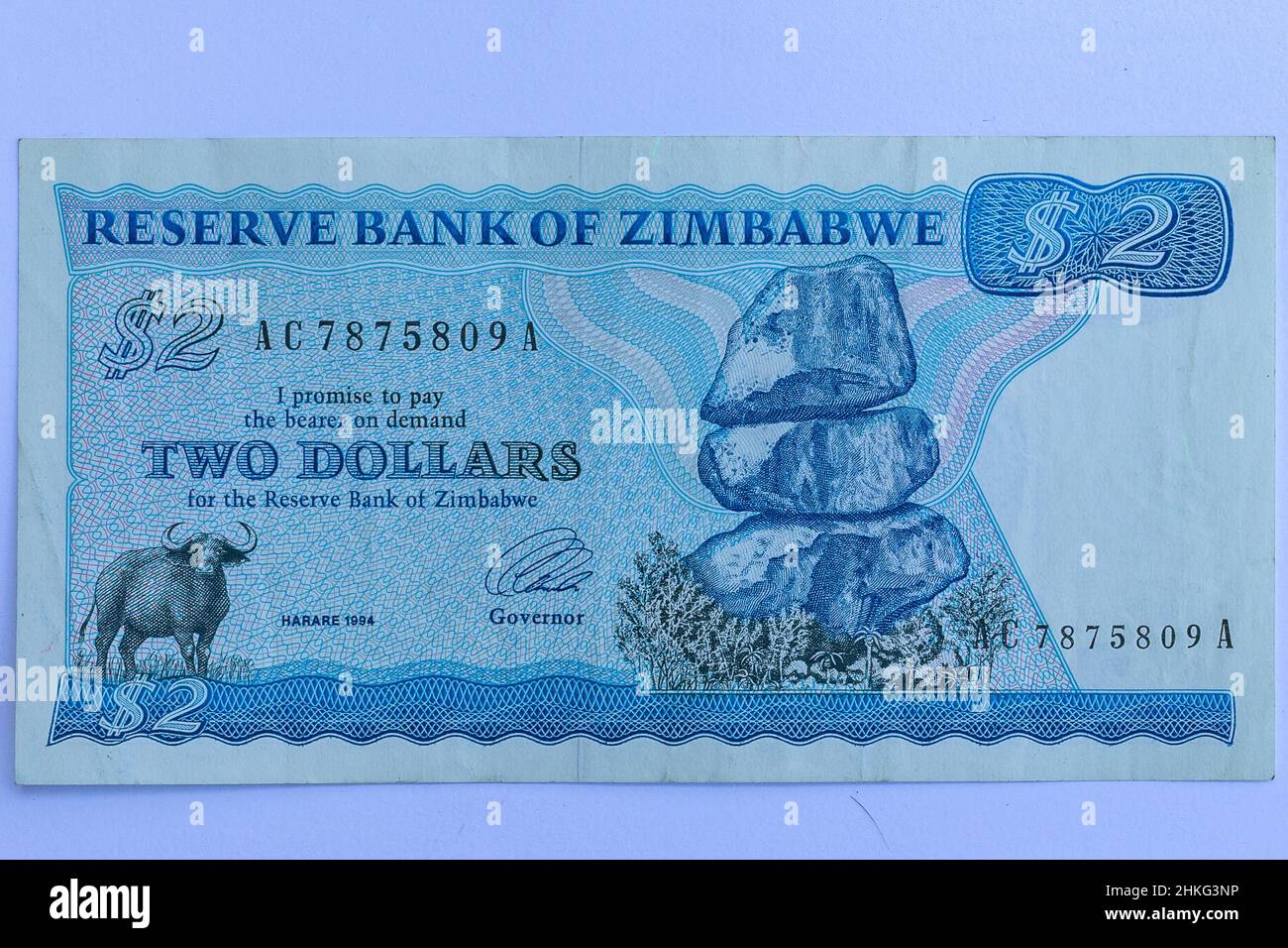 Money Zimbabwe two dollar note currency history of  fiat  paper banking inflation obsolete vintage. Stock Photo