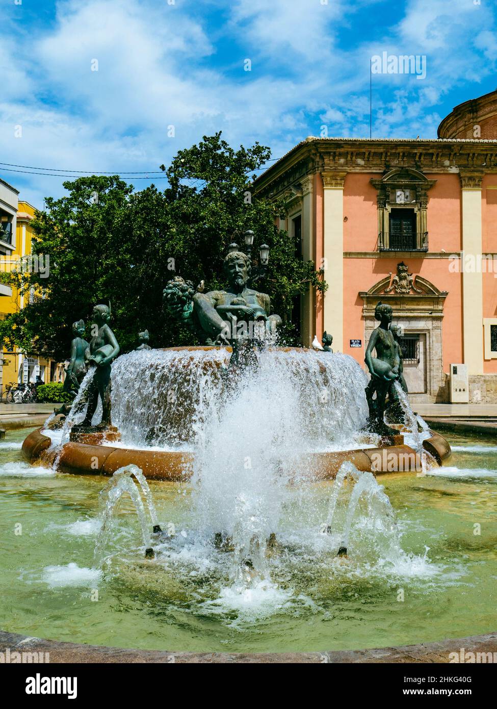 The Turia fountain in la Plaza de la Virgen in front of theBasilica Virgen de los Desamparados, Cuitat Vella, Valencia, Spain Stock Photo