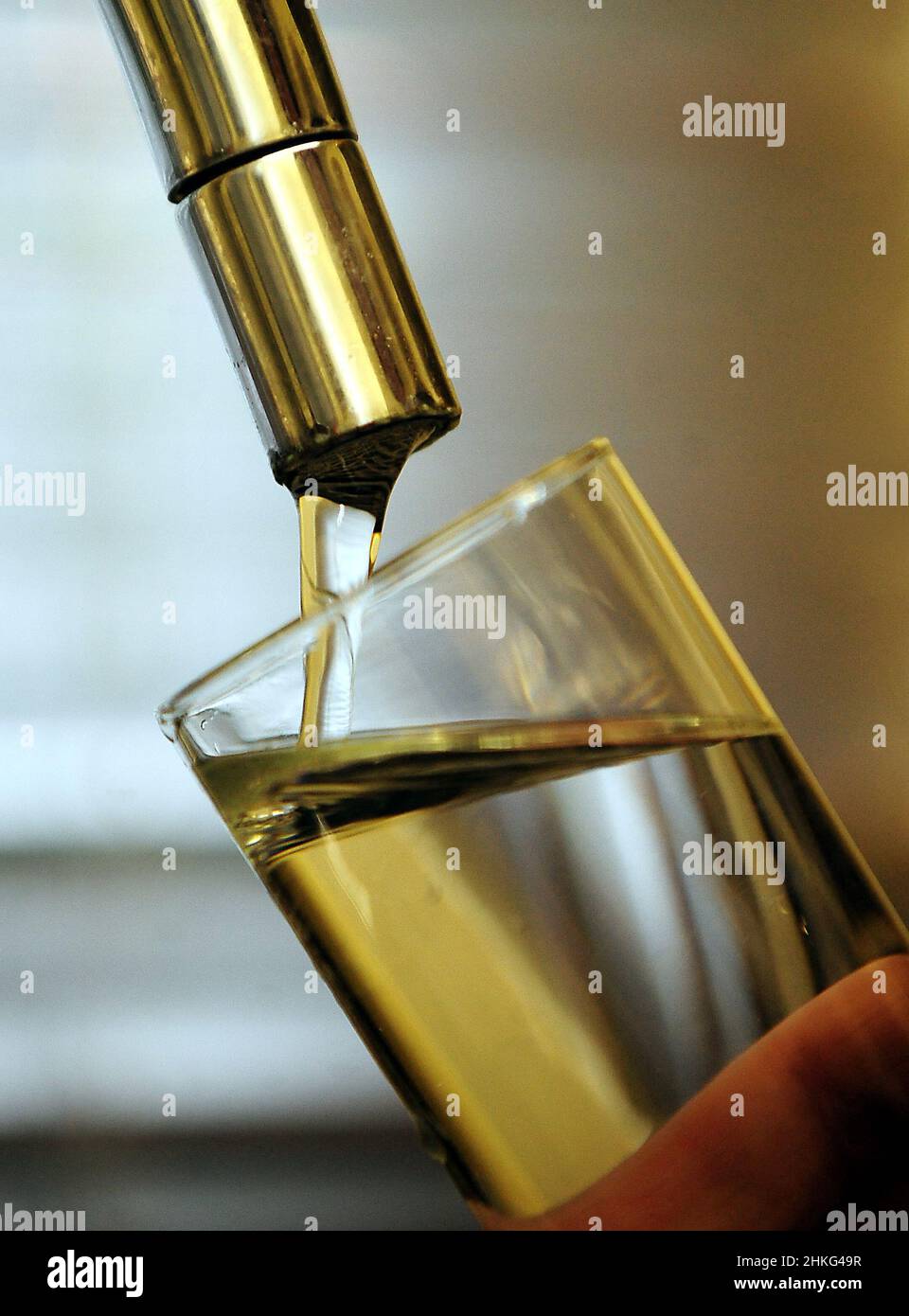 File photo dated 31/01/12 of a generic view of a household water tap filling up a glass, as water bills are set to rise from April, it has been announced, adding to the cost of living crisis due to hit households across the country. Stock Photo