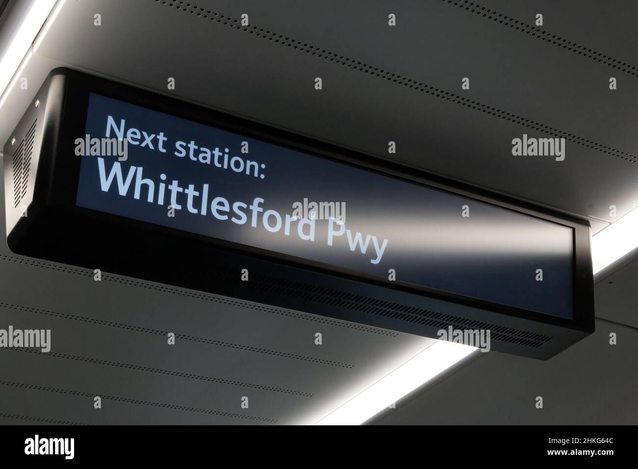 An information sign suspended from the ceiling of a train informs that the next station is Whittlesford Parkway. Stock Photo