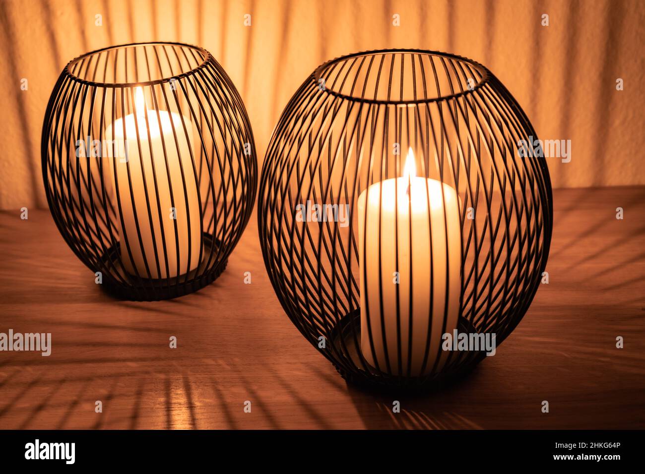 candles in decoration, candlelight through grid, shade Stock Photo