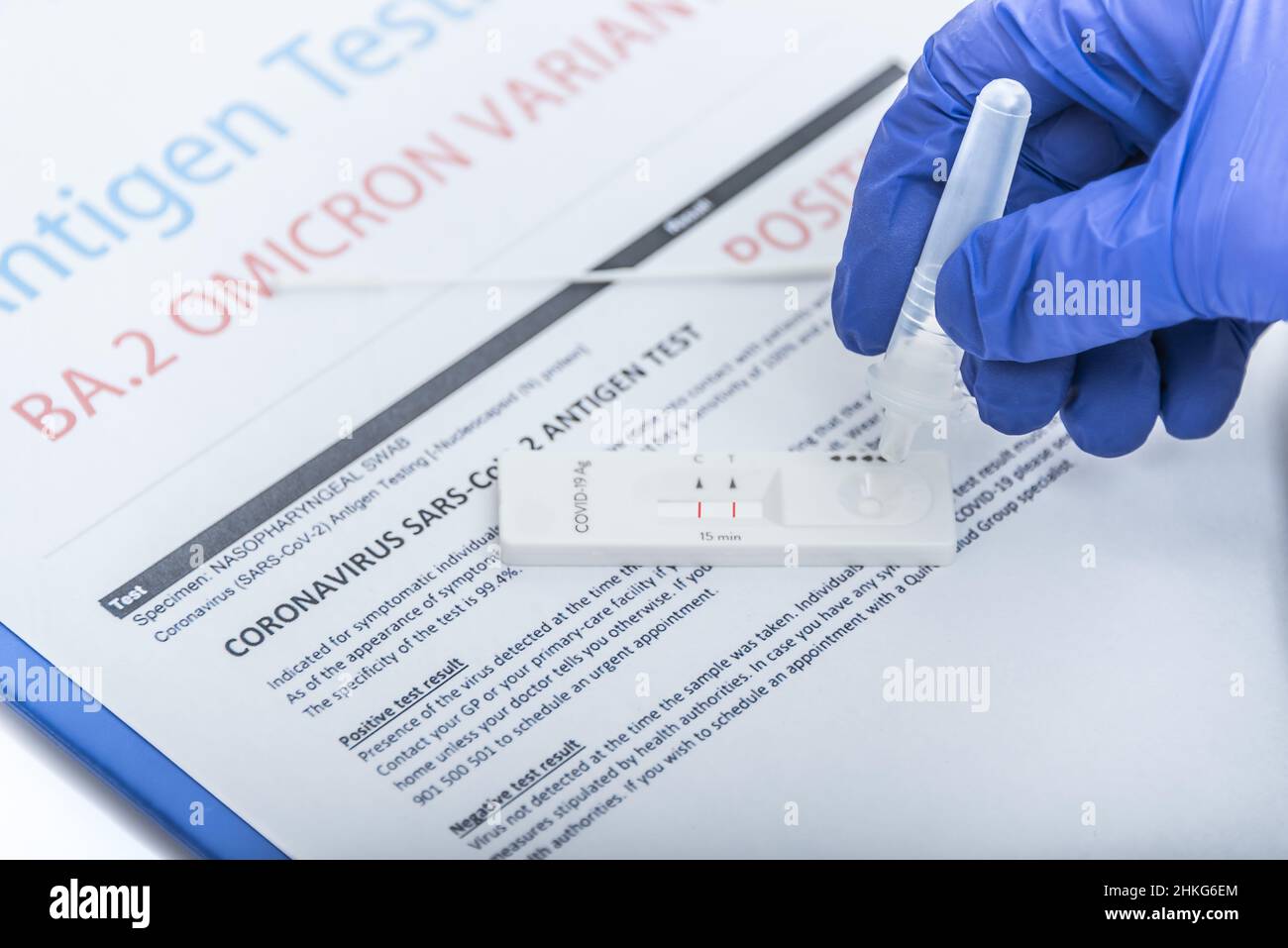 Omicron positive, antigen test kit positive with Omicron or BA.2 variant of COVID-19 coronavirus. Stock Photo