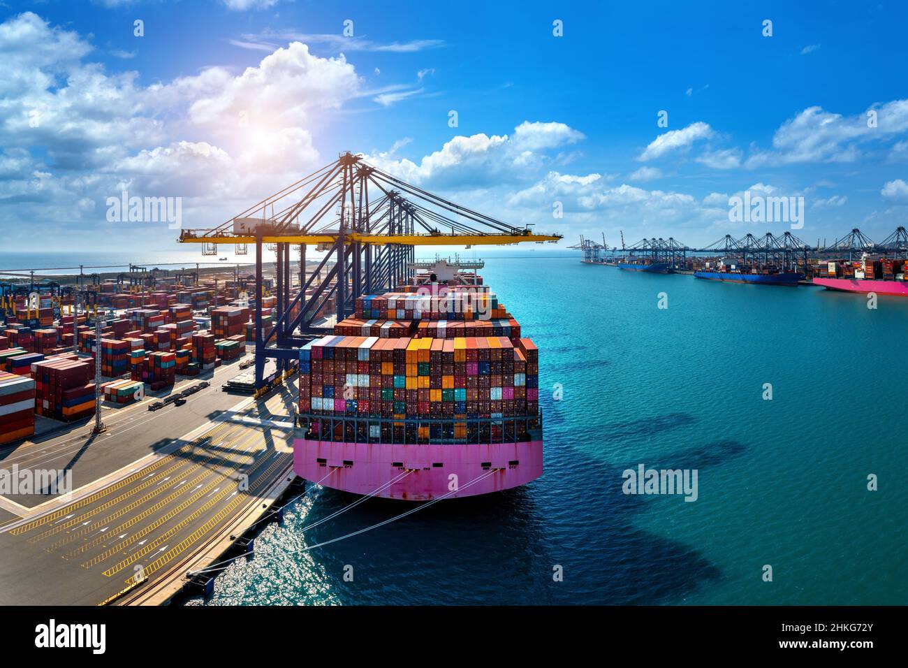 Aerial view of cargo ship and cargo container in harbor Stock Photo - Alamy