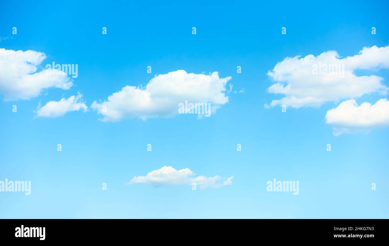 Idyllic blue sky with white clouds - background with copyspace Stock Photo