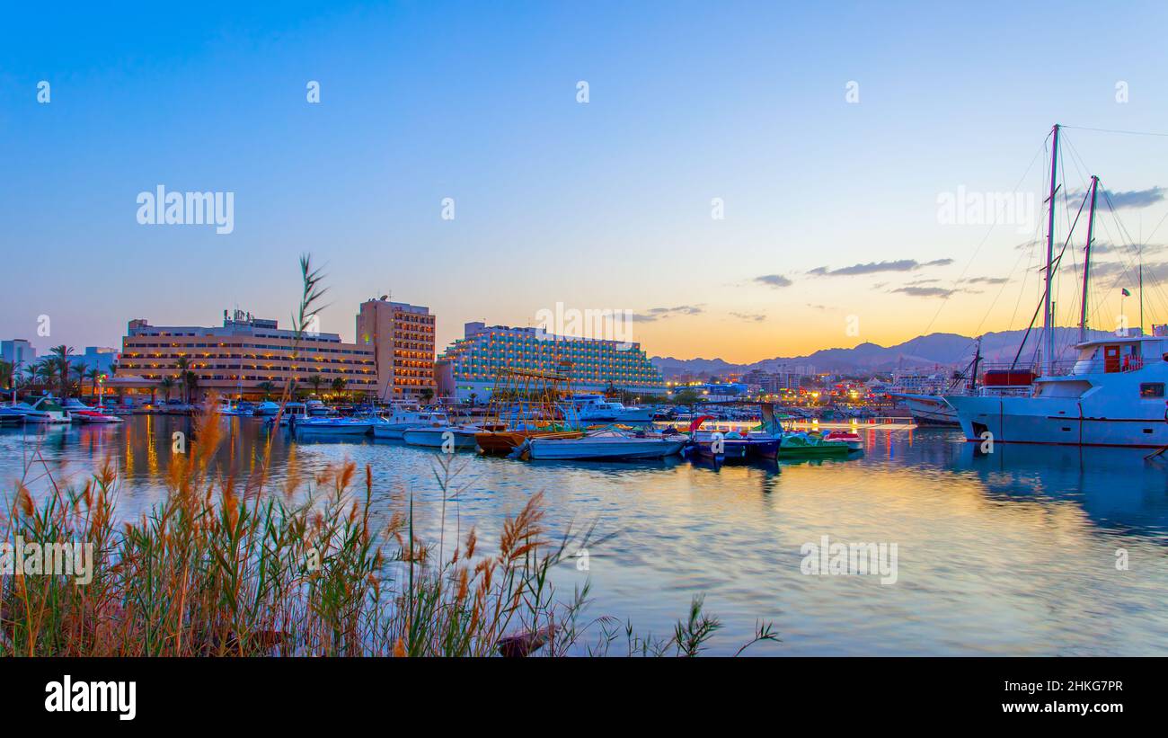 Harbor with boats in Eilat at dusk, Israel Stock Photo
