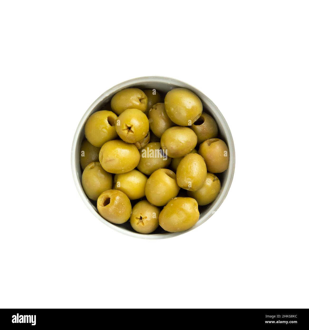 Green pitted olives in a bowl isolated over white. Top view, from above Stock Photo Alamy