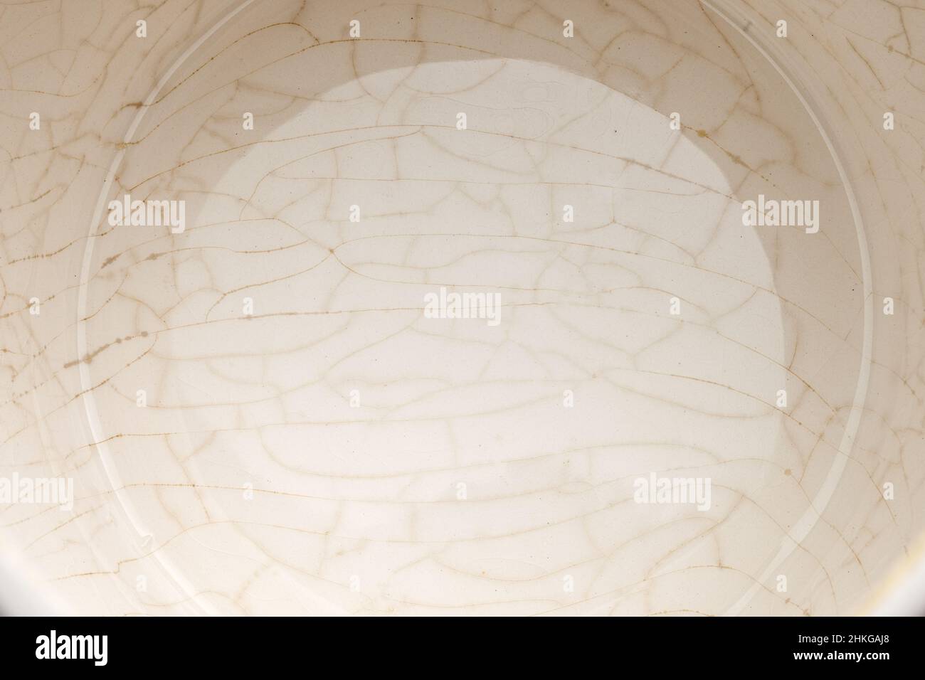 cracked glaze on the bottom of a white ceramic cup Stock Photo Alamy