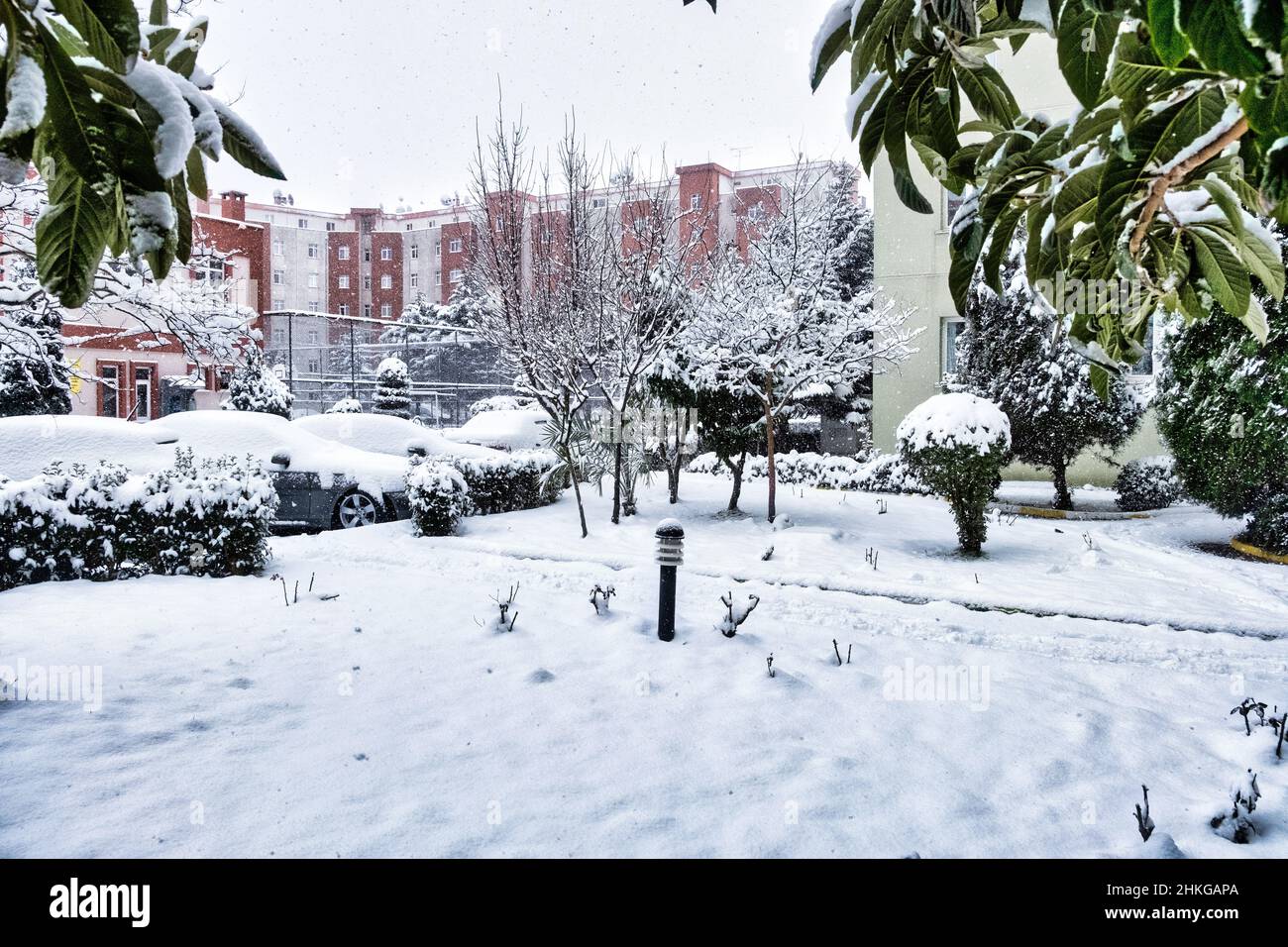 Concept idea of a snow covered place, sports ground and car parking lots with snow covered landscape Stock Photo