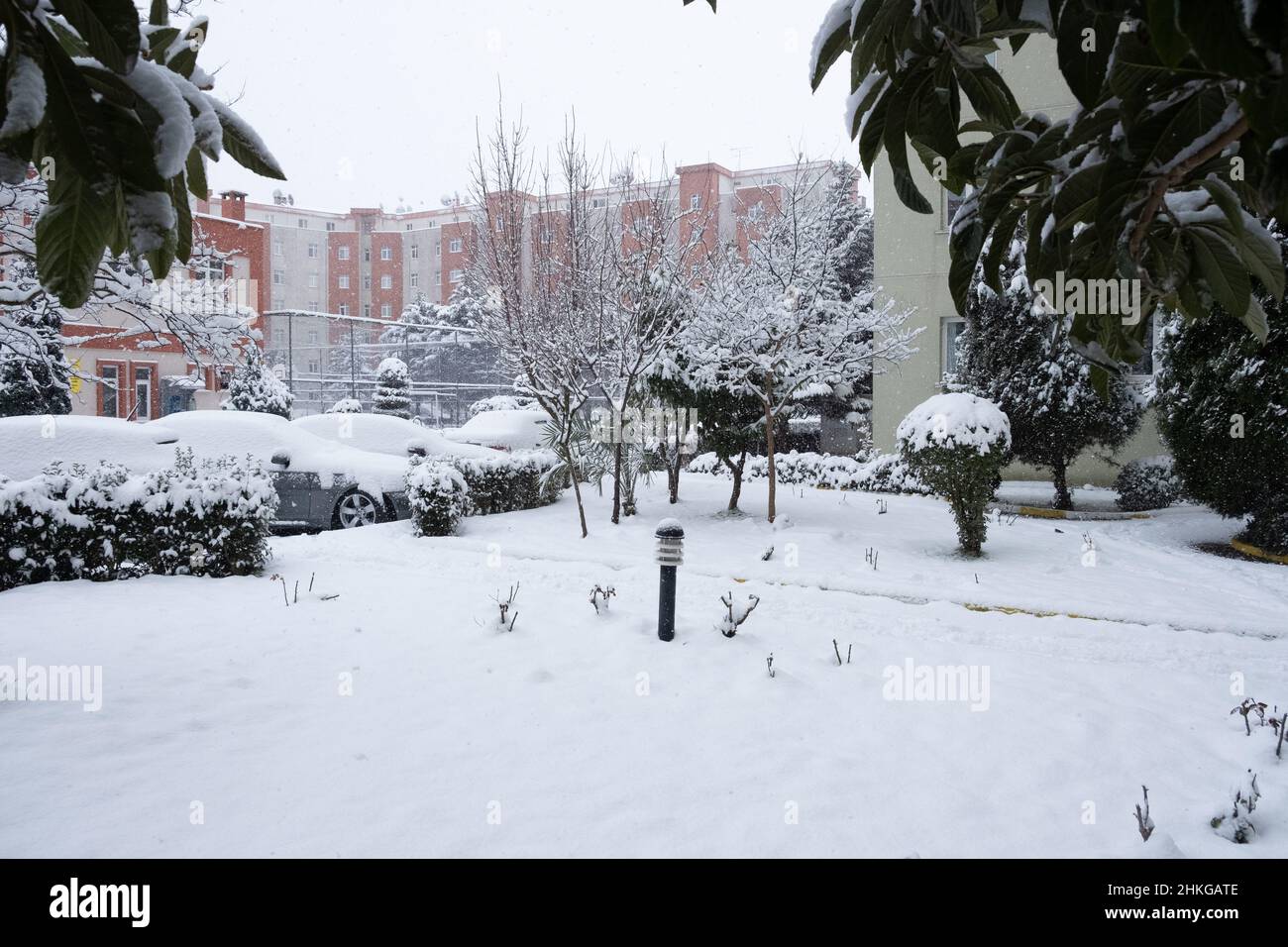 Concept idea of a snow covered place, sports ground and car parking lots with snow covered landscape Stock Photo