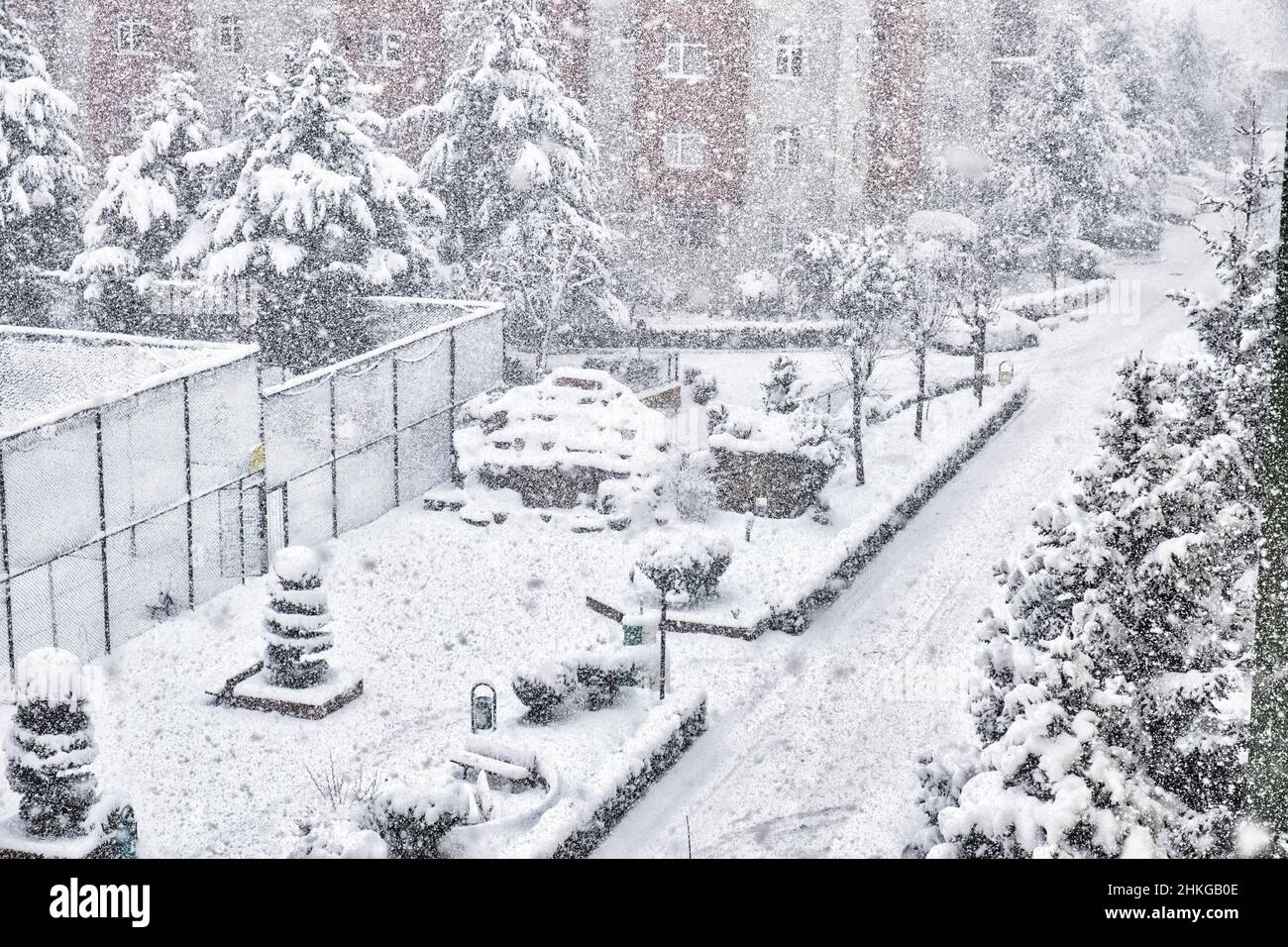 Concept idea of a snow covered place, sports ground and car parking lots with snow covered landscape Stock Photo