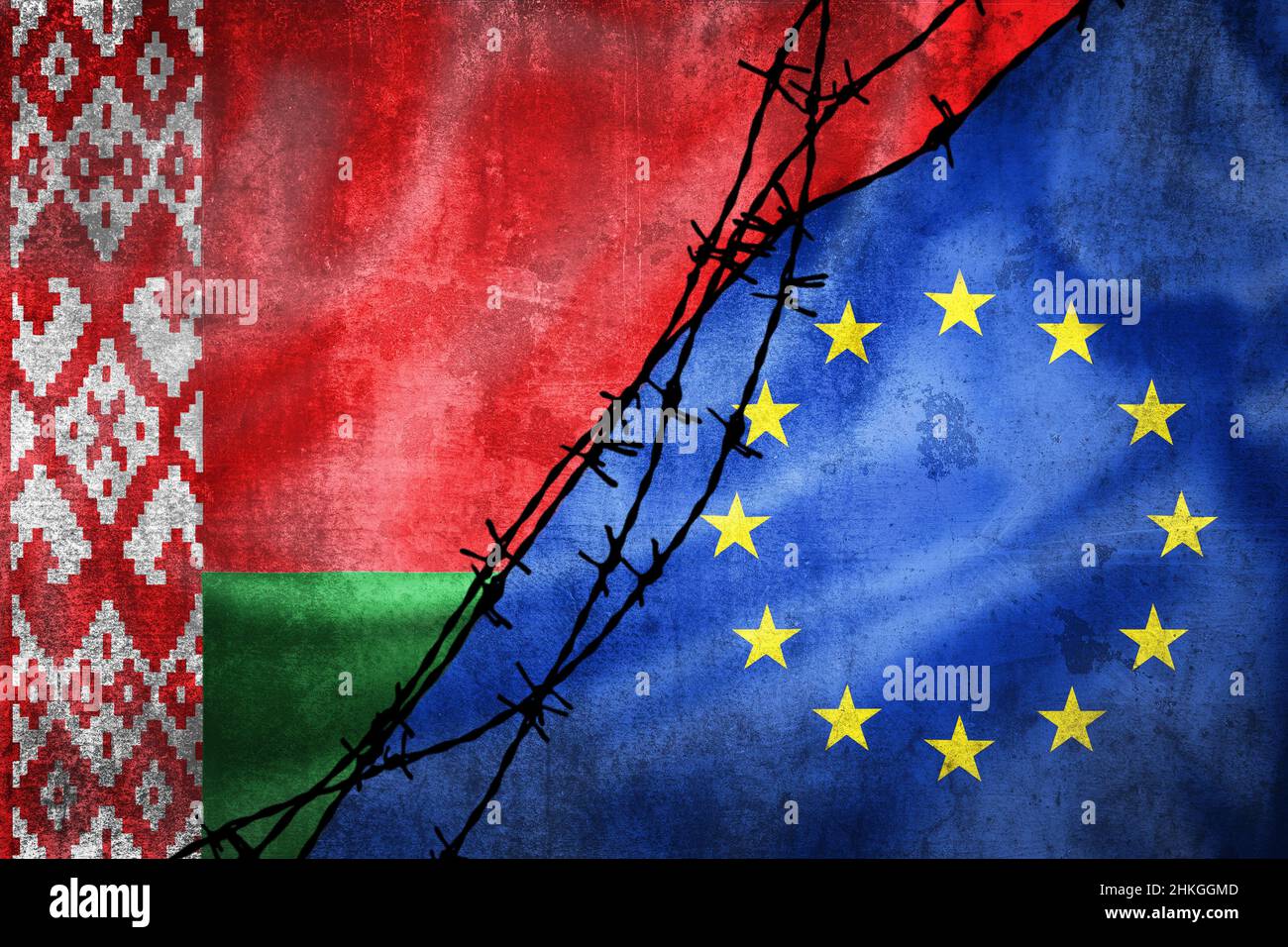 Grunge flags of Belarus and European Union divided by barb wire illustration, concept of tense relations in migrant border crisis Stock Photo
