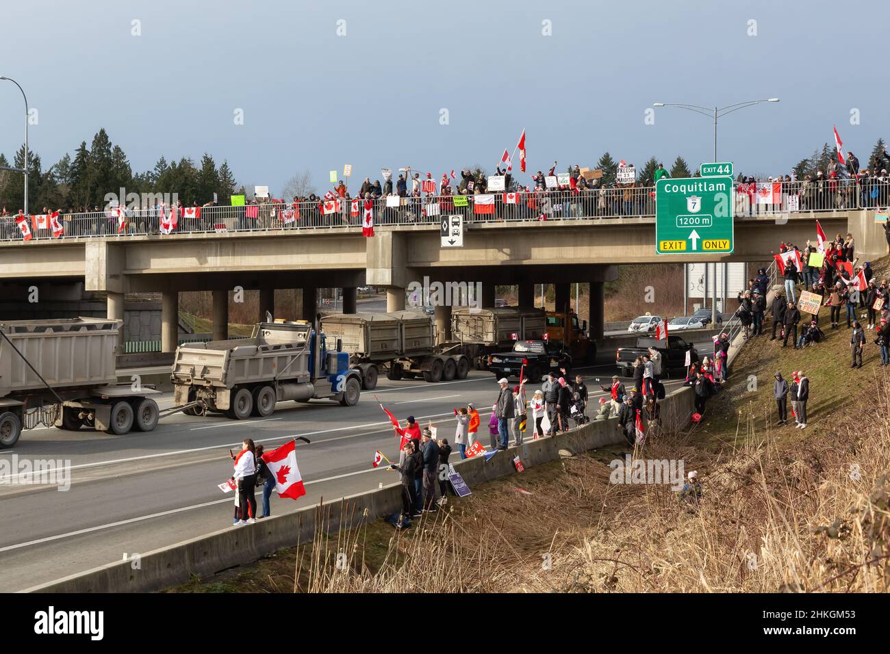 People on the Highway Supporting the Freedom Rally and the protest of the Truck Drivers against Vaccine Mandate Stock Photo