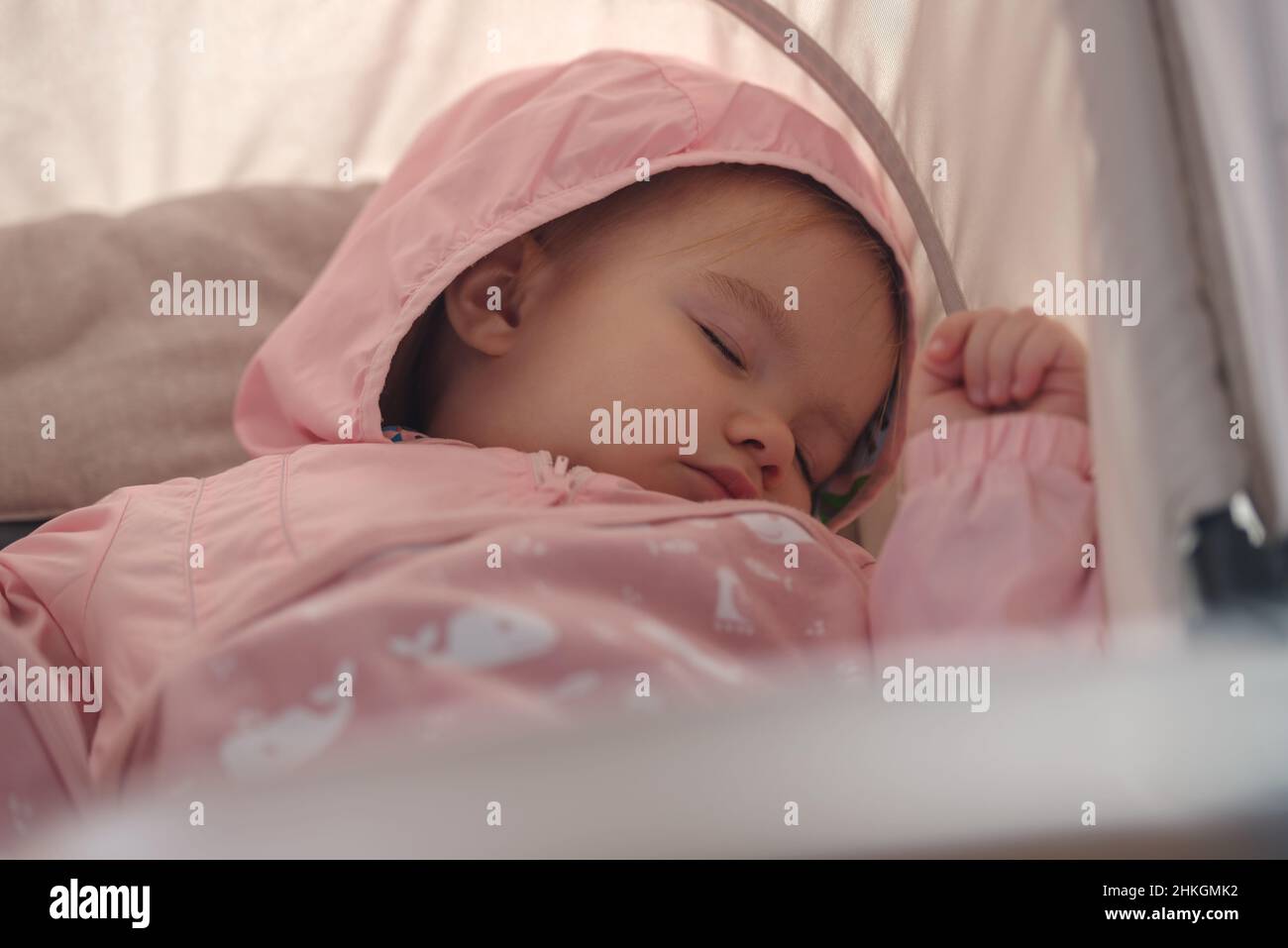 Baby girl sleeping in baby stroller outdoor Stock Photo Alamy