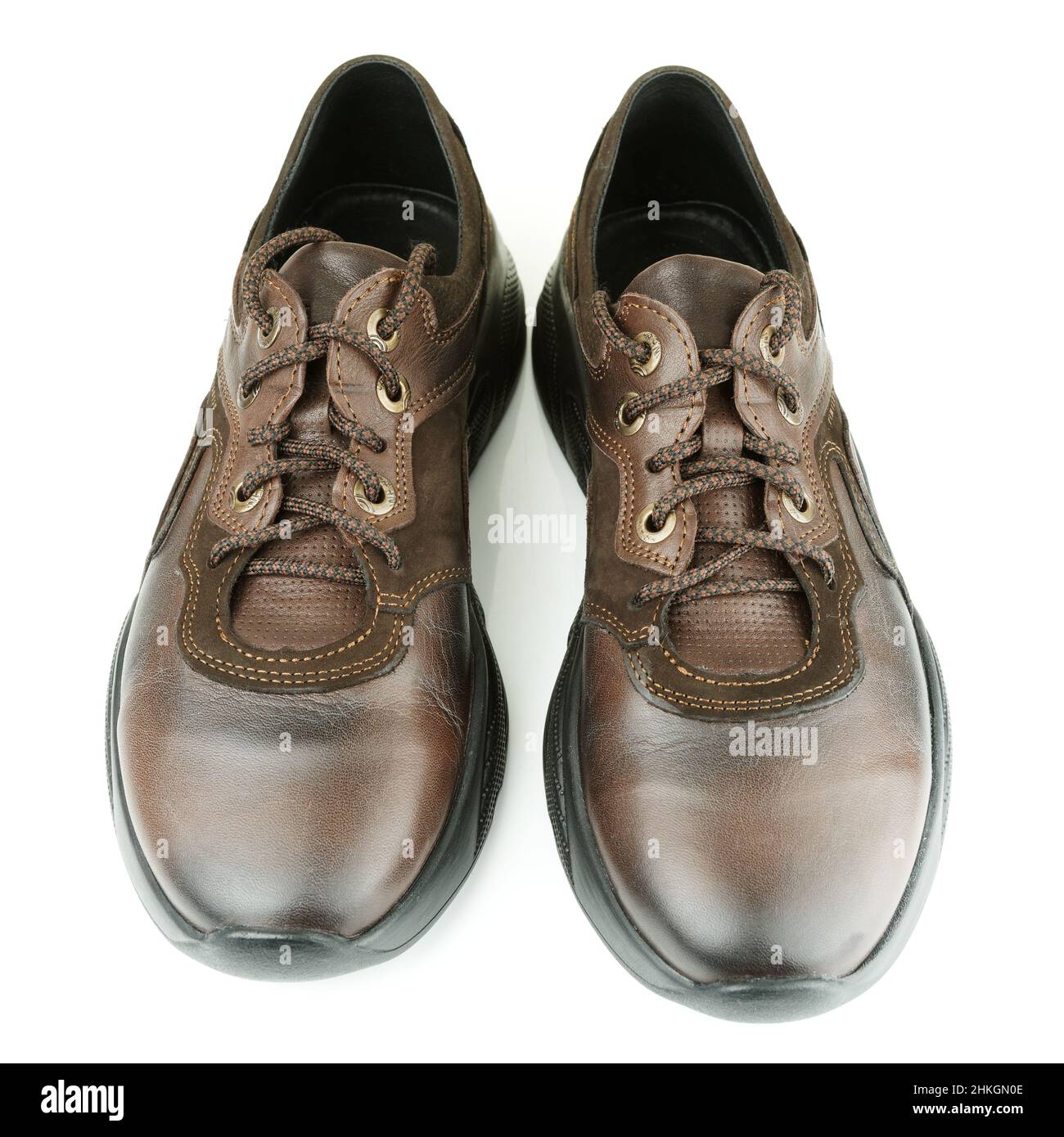 Pair of brown leather walking shoes on white background Stock Photo