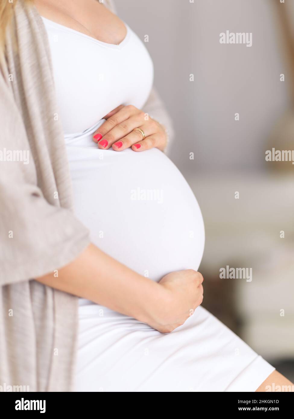 Her motherly instincts have already kicked in Stock Photo