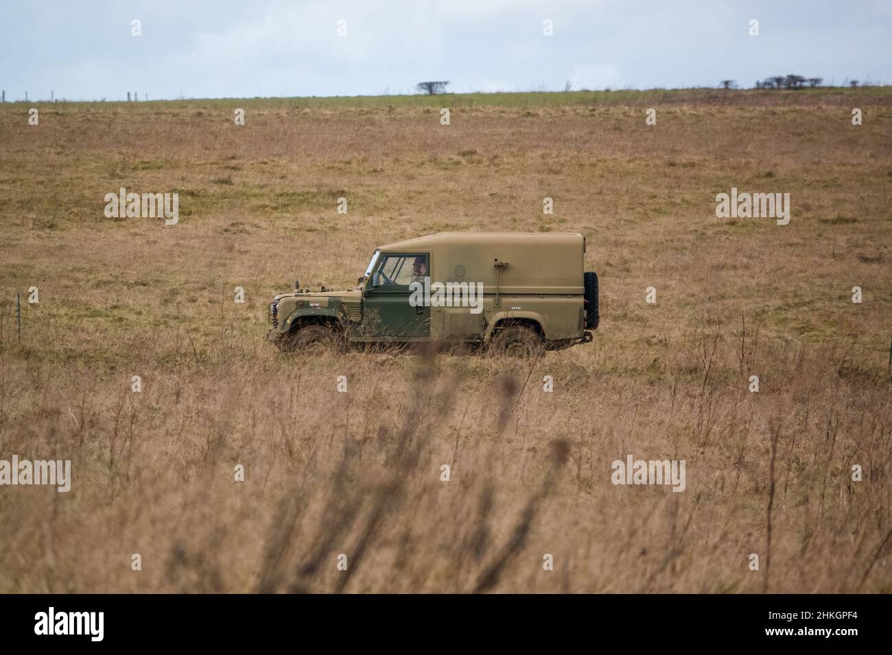 land rover defender wolf army medium utility vehicle on a military ...