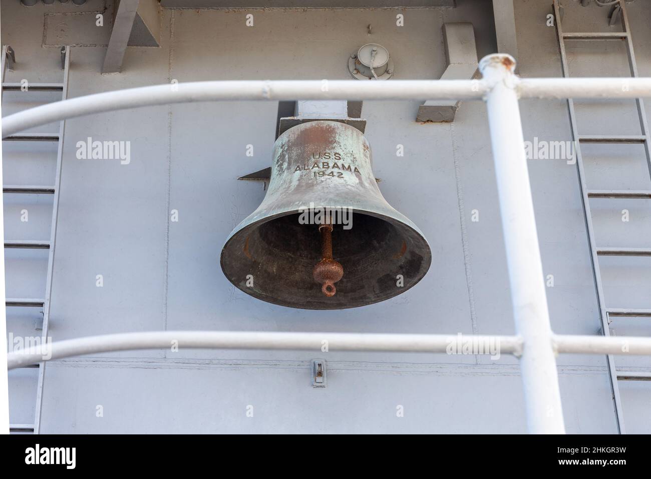 Ships bell on the USS Alabama (BB-60), a battleship that served during World War II.  Concepts could include history, war, defense, navy, other. Stock Photo