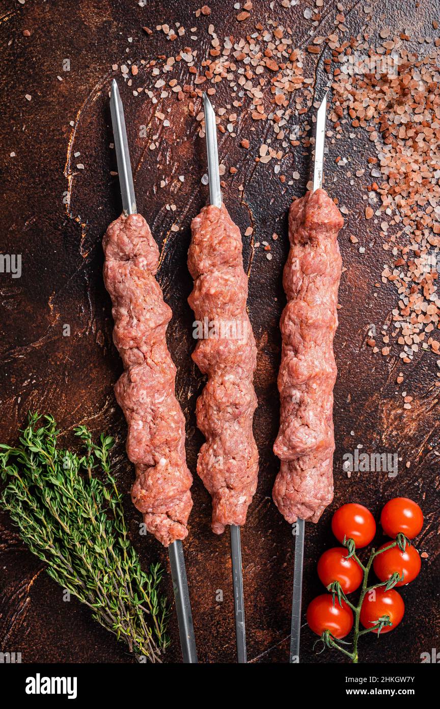 Turkish adana kebab on Skewers from Raw mince lamb and beef meat, shish