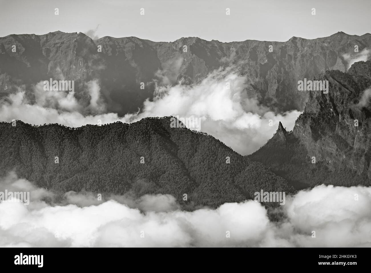 Black and white view from the top of the Pico Birigoyo to the Caldera de Taburiente with La Cumbrecita in La Palma, Spain and passat clouds in the val Stock Photo