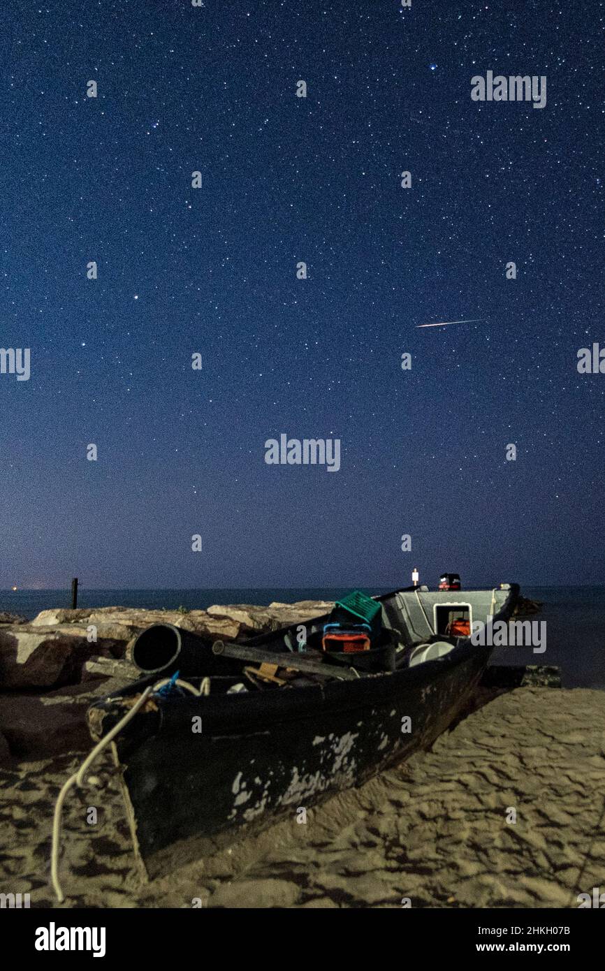 Beach and sea at night with starry sky Stock Photo