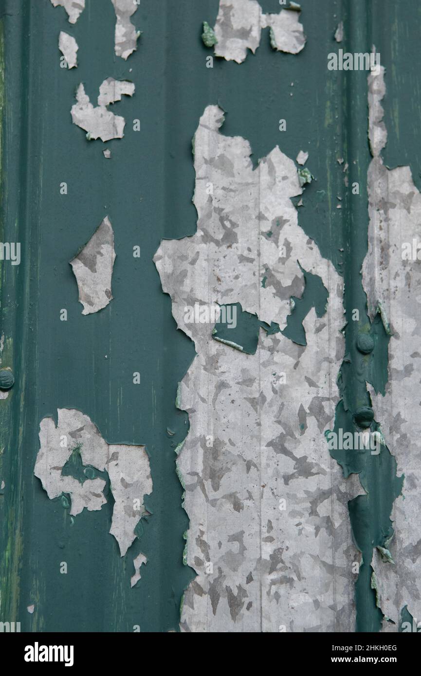 peeling green paint on old metal door paint peeling to reveal grey and