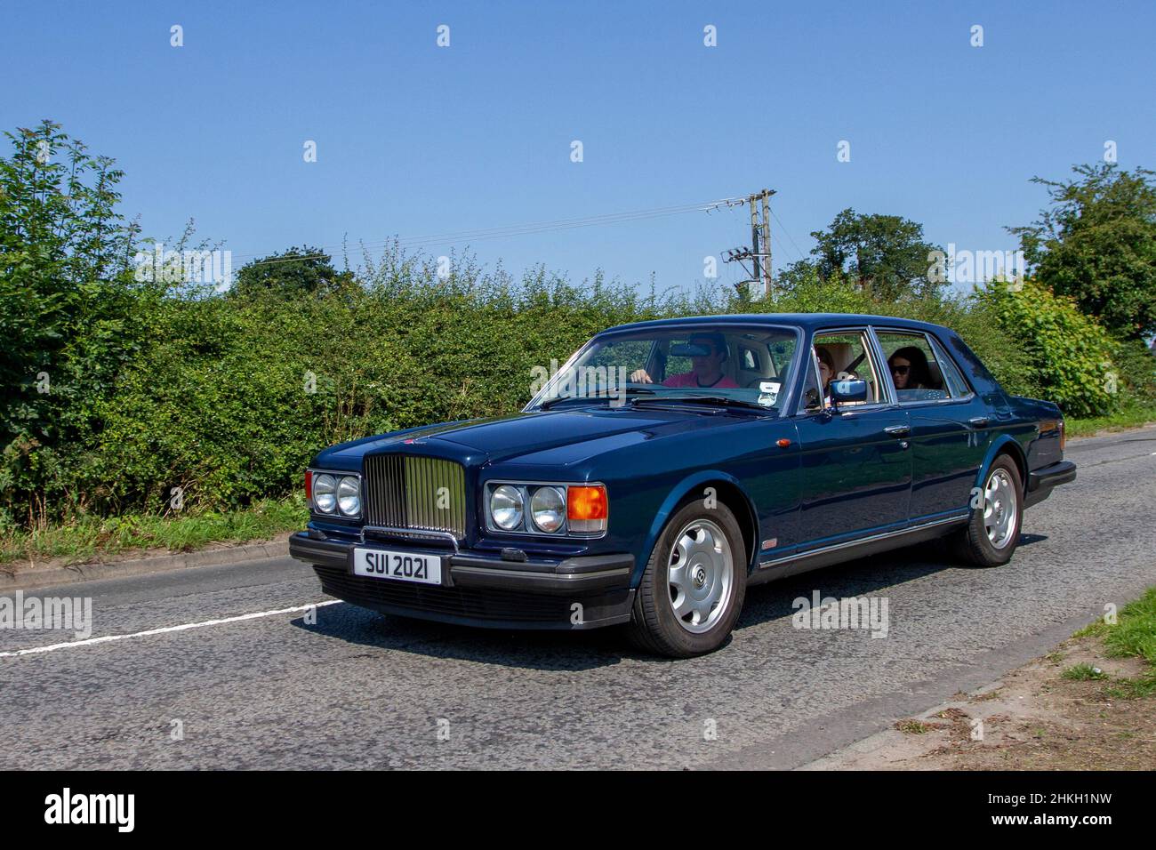 1987 80s eighties blue Bentley Turbo 6750cc petrol 3 speed automatic; en-route to Capesthorne Hall classic July car show, Cheshire, UK Stock Photo